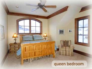 queen bed at the bineasz house in crested butte